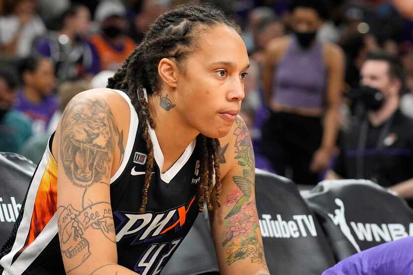 FILE - Phoenix Mercury center Brittney Griner sits during the first half of Game 2 of...