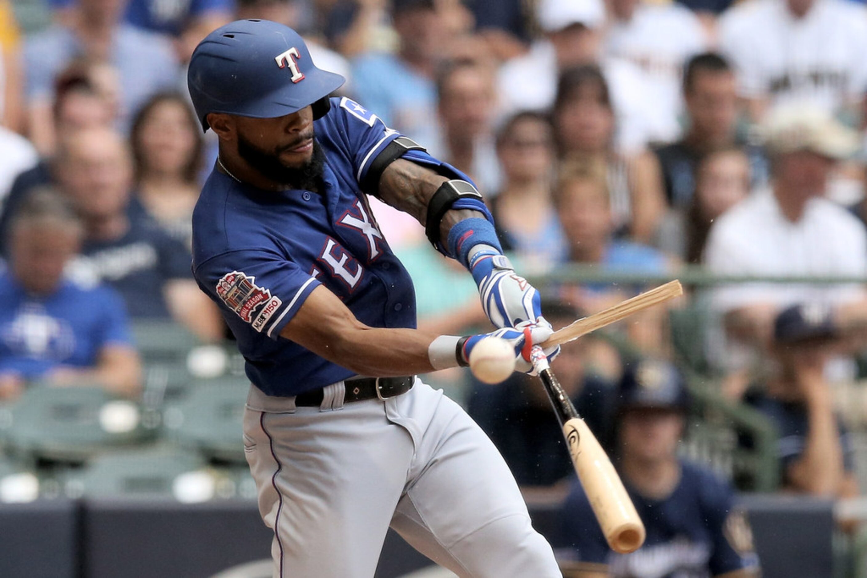 MILWAUKEE, WISCONSIN - AUGUST 11:  Delino DeShields #3 of the Texas Rangers breaks his bat...