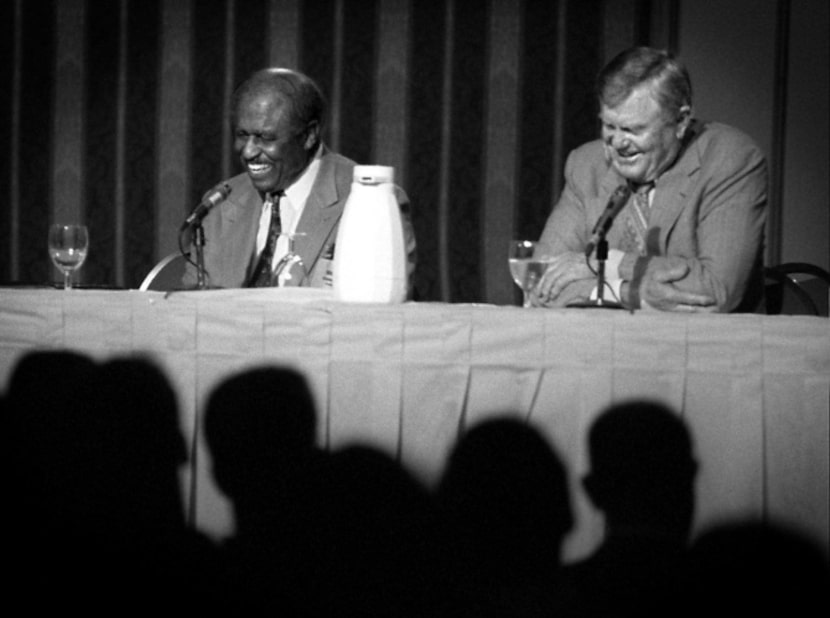 Eddie Robinson, coach at Grambling, and Darrell Royal former coach of Texas, share a laugh...