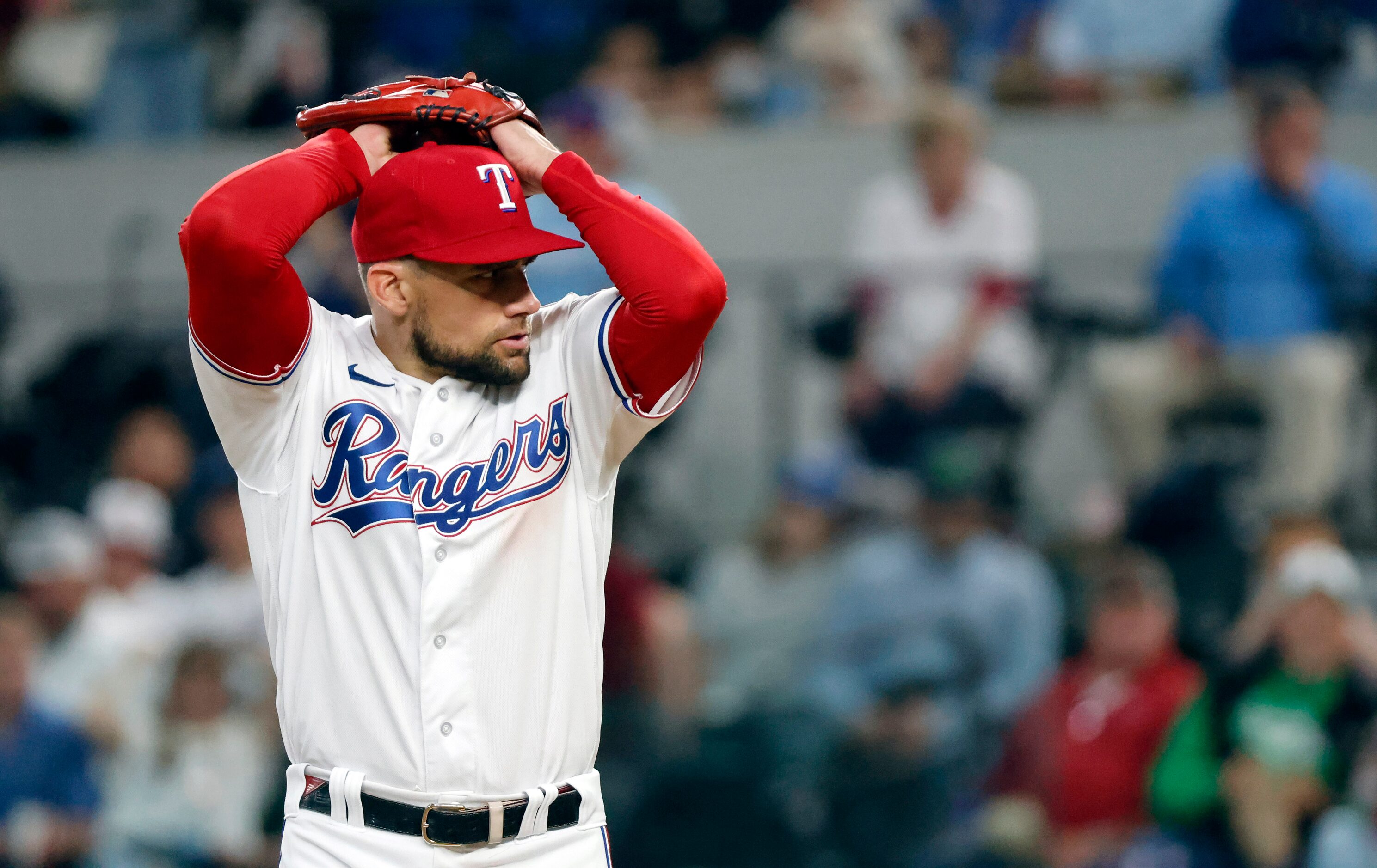 Texas Rangers starting pitcher Nathan Eovaldi (17) winds up to throw a sixth inning pitch...