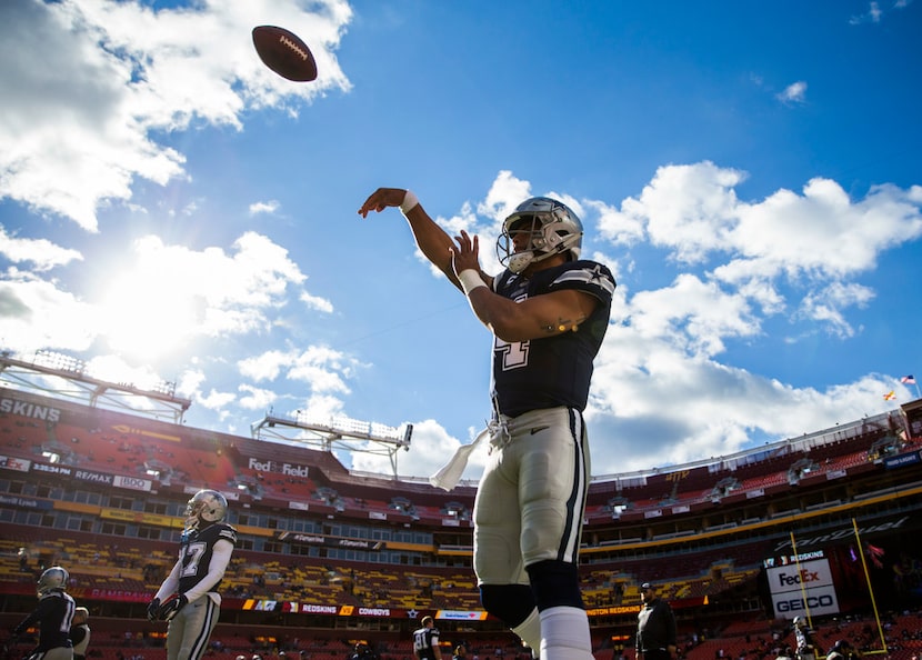 Dallas Cowboys quarterback Dak Prescott (4) warms up before an NFL game between the...