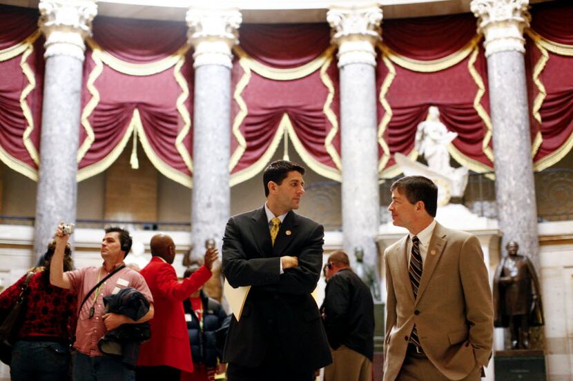 Republican Reps. Paul Ryan of Wisconsin (left) and Jeb Hensarling of Dallas walk to the...