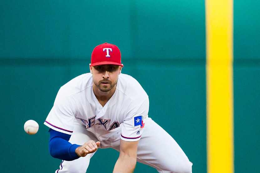Texas Rangers third baseman Joey Gallo makes a play on a grounder by Philadelphia Phillies...