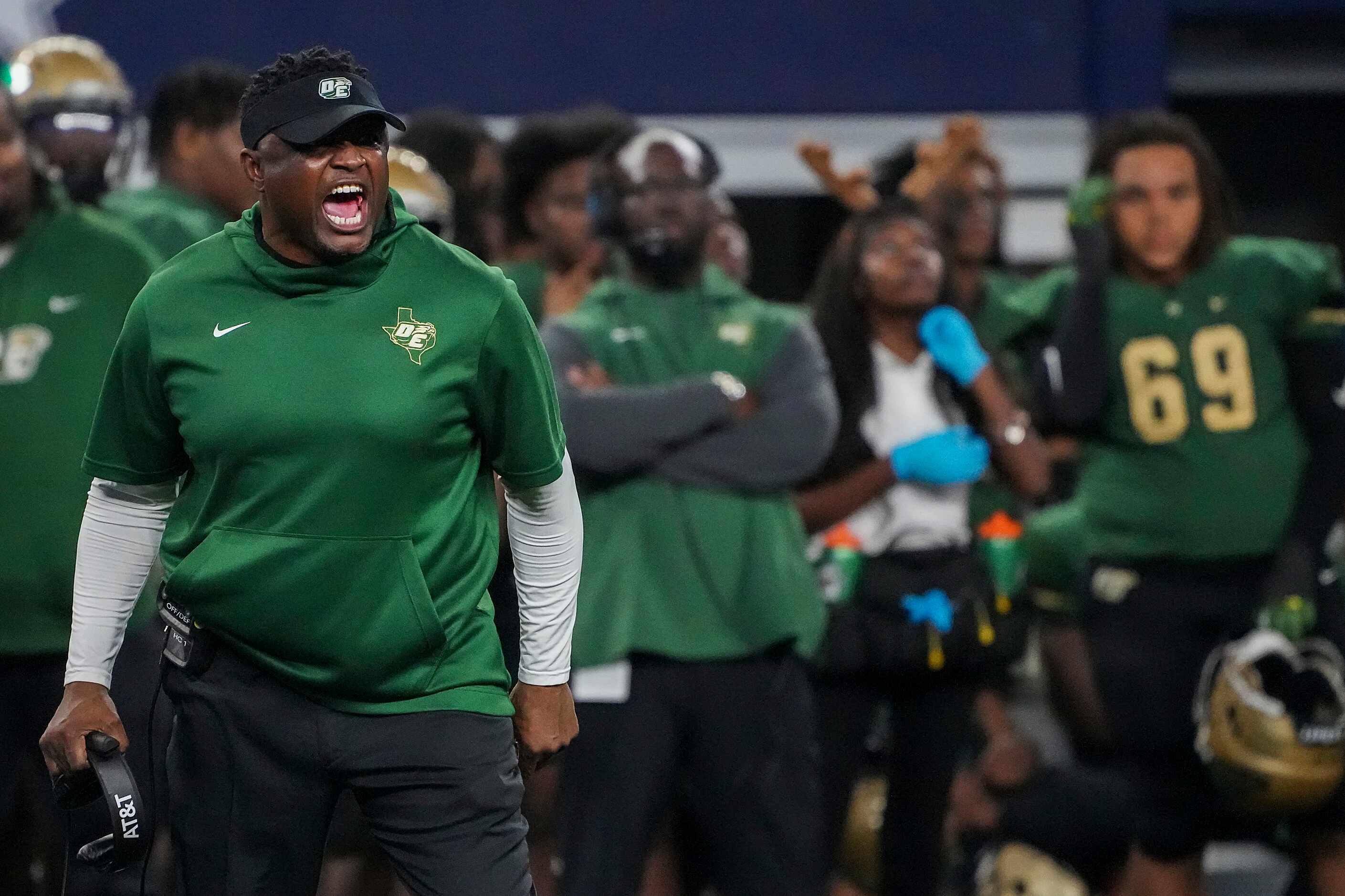 DeSoto head coach Claude Mathis reacts after a penalty was called against his team during...