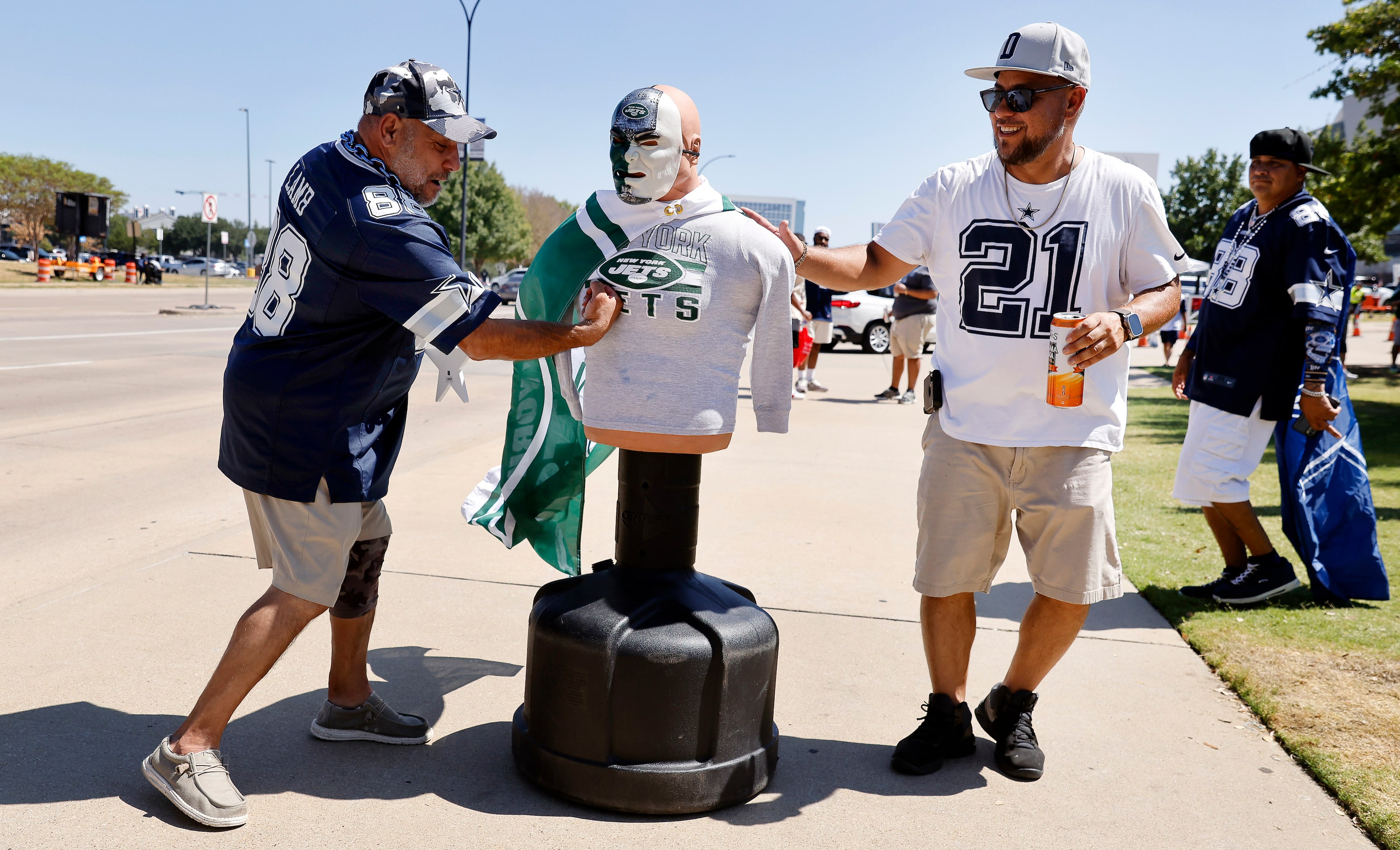 Dallas Cowboys fan Sal Barrientes of Corpus Christi levels a punch on a New York...