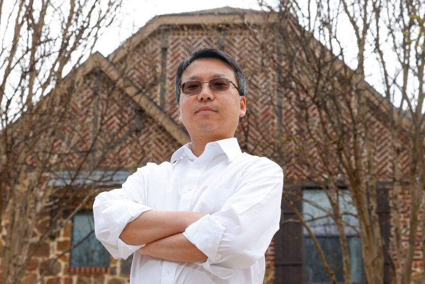 Allen resident Jerry Pi poses for a portrait in front of his house on Wednesday, March 29,...