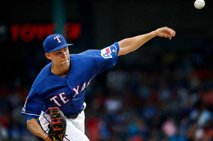 Texas Rangers starting pitcher Mike Minor (23) throws against the Houston Astros in the...