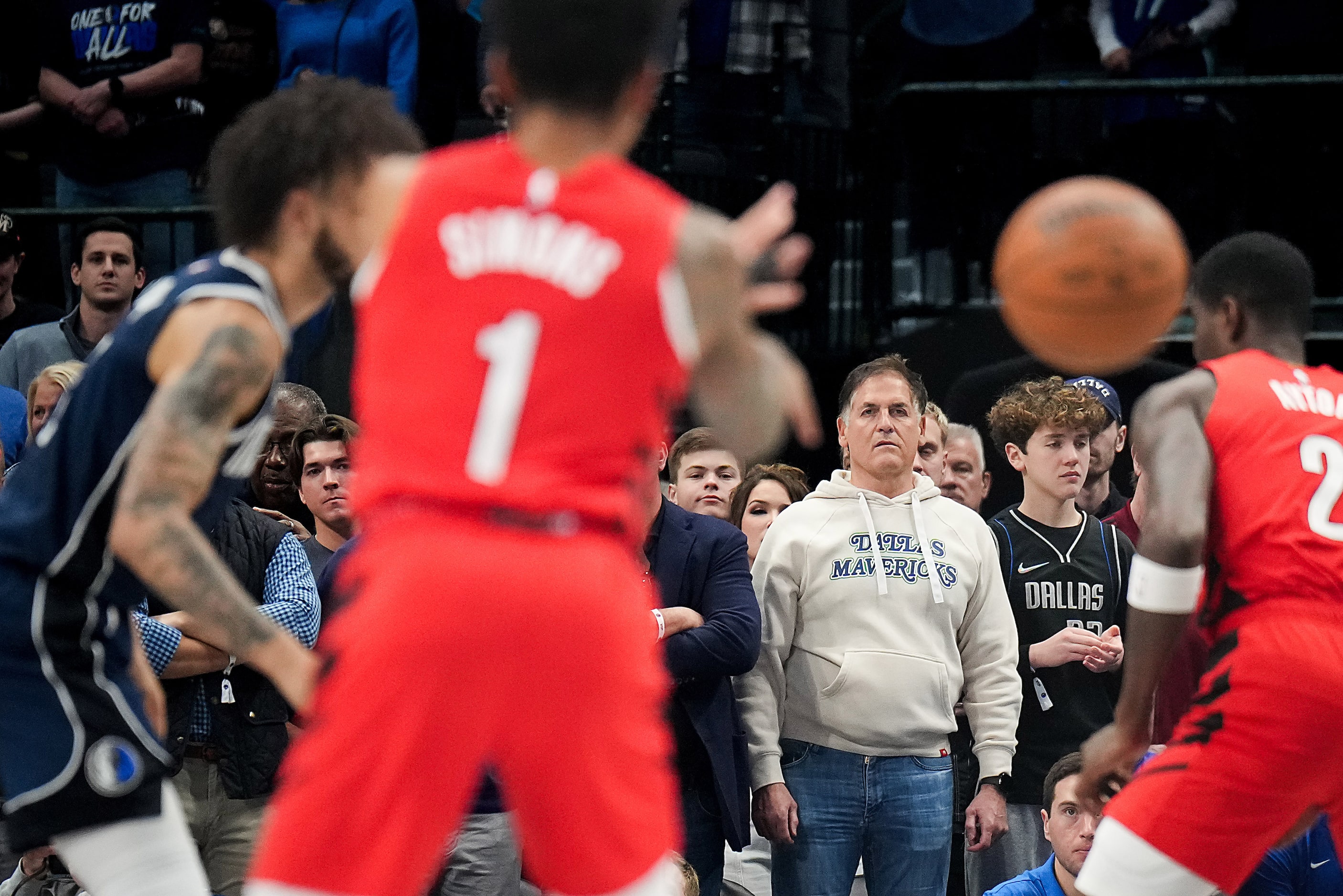 Mark Cuban watches during the first half of an NBA basketball game between the Dallas...