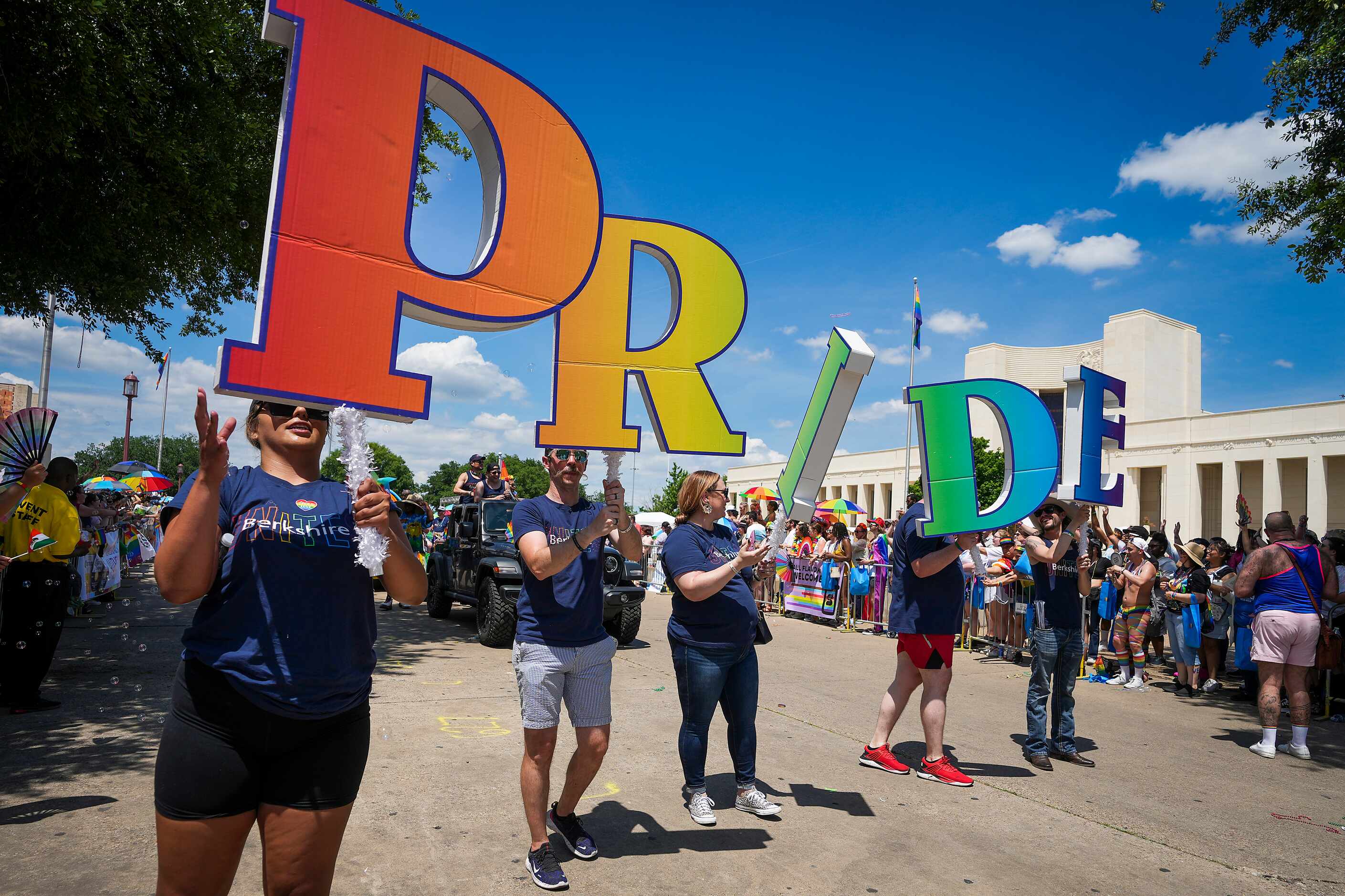 Participants from Berkshire Residential Investments spell out “Pride” as they march in the...