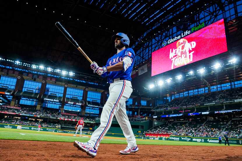 Texas Rangers infielder Marcus Semien heads to the plate during the third inning of an...