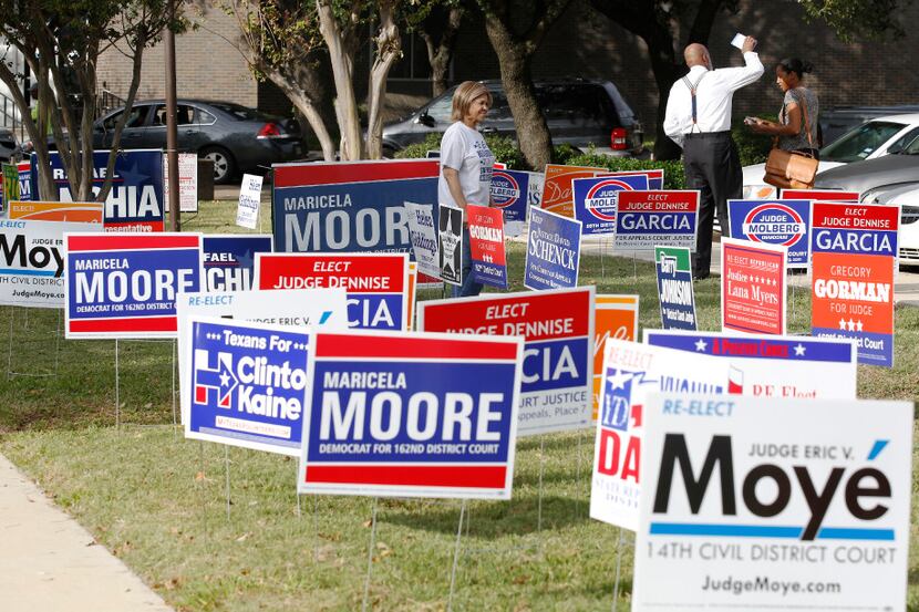 Candidates handed out fliers to voters at the Dallas County Government Center, Precinct 5,...