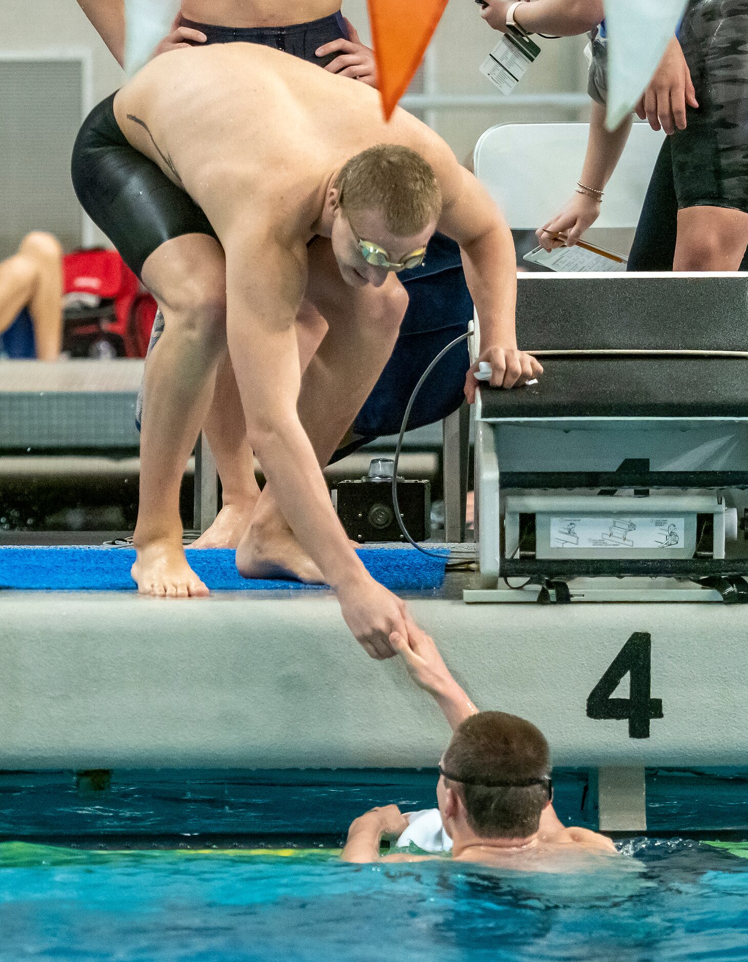 Keller's Maximus Williamson shakes hands with teammate, River Paulk after they competed in...