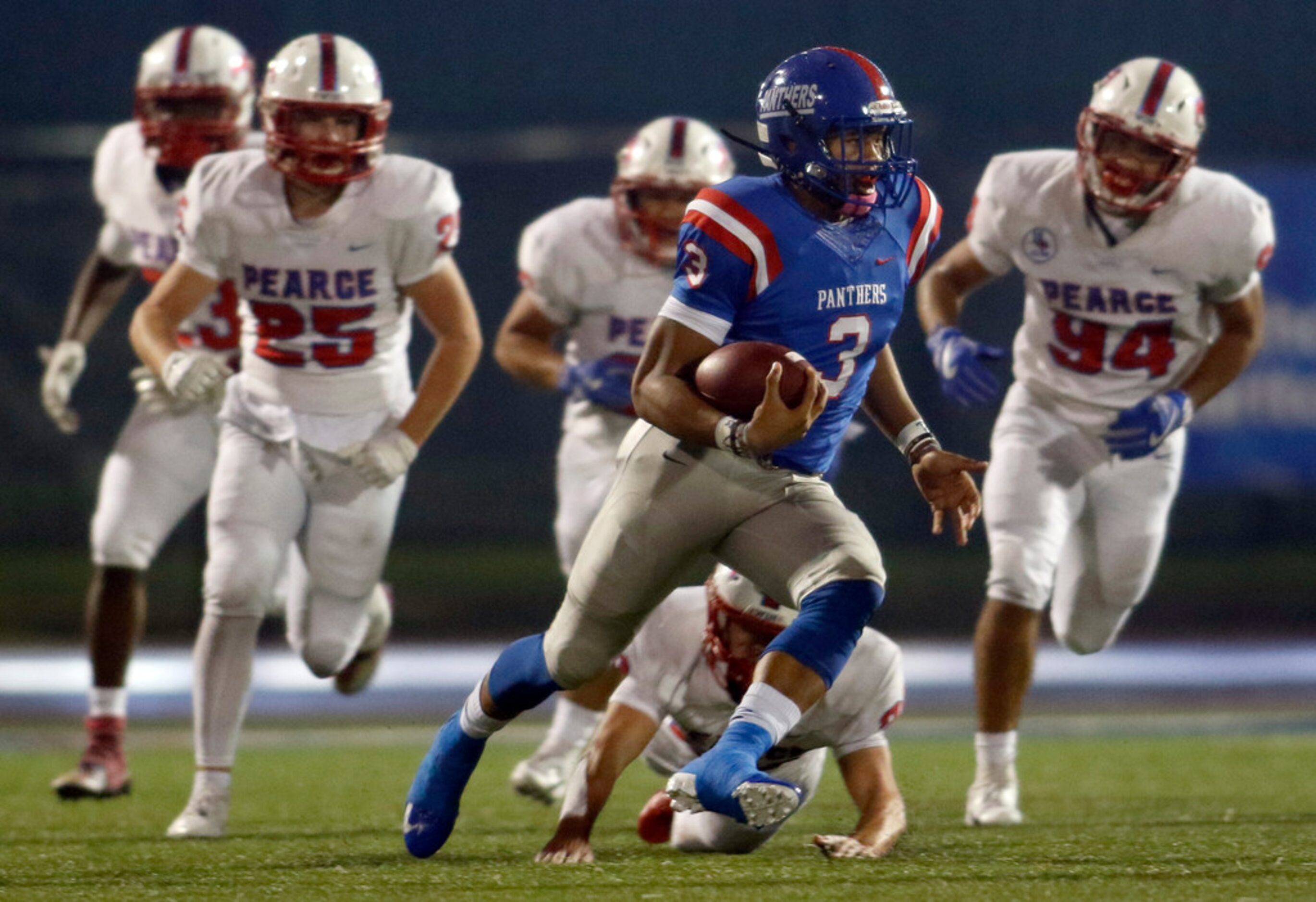 Duncanville quarterback Ja'Quinden Jackson (3) cuts as he rambles through the Richardson...