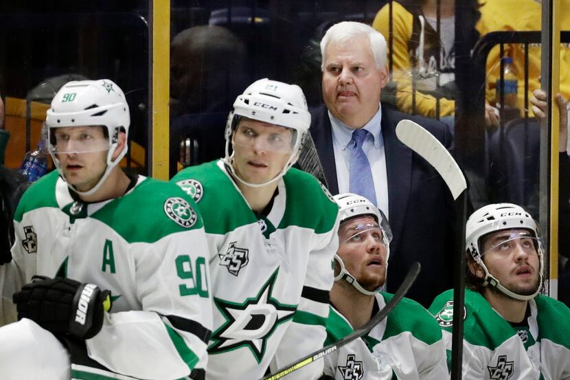 Dallas Stars head coach Ken Hitchcock watches from the bench in the third period of an NHL...