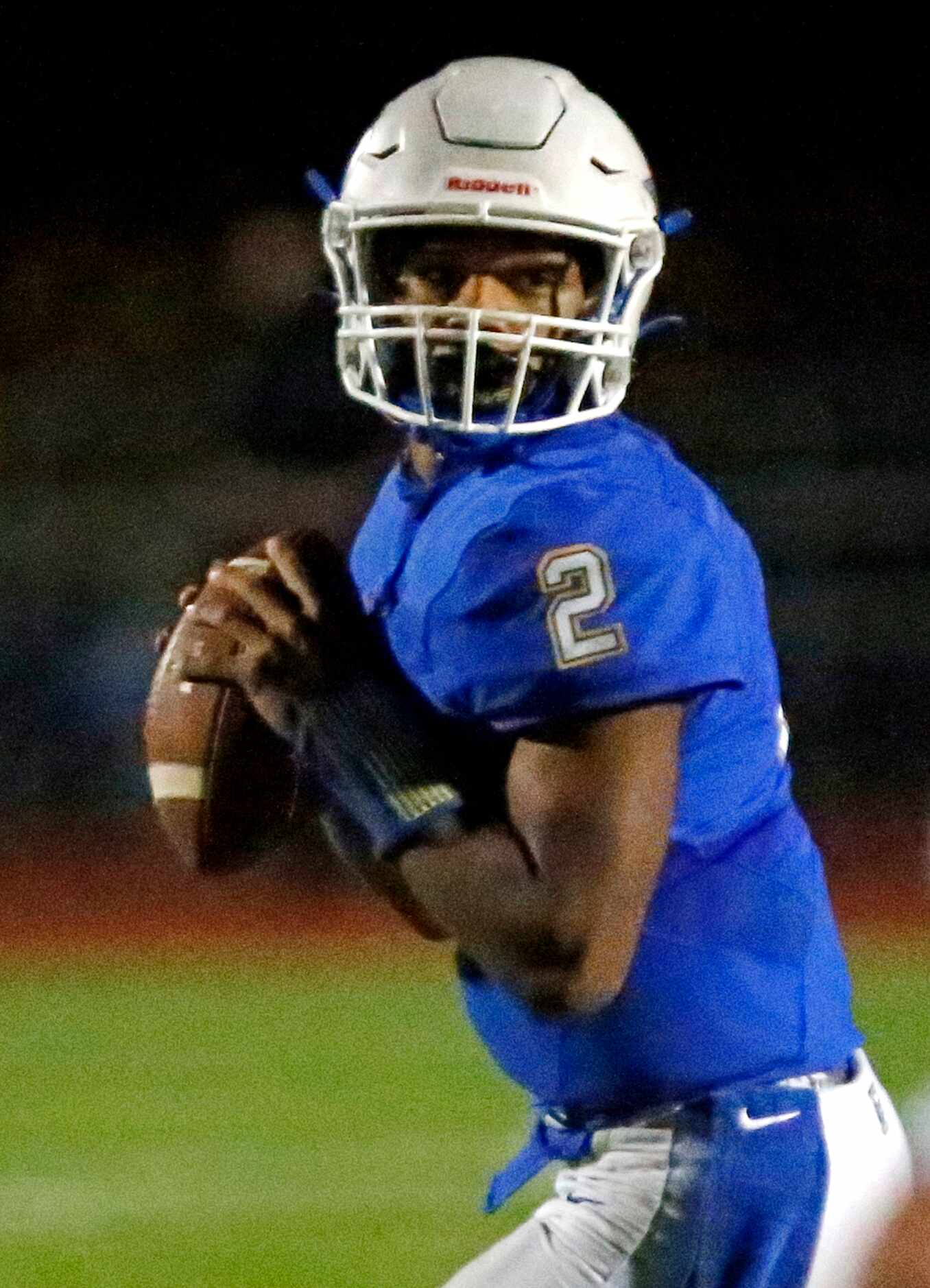 Frisco High School quarterback Caree Green (2) looks to pass during the second half as...