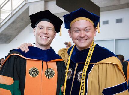 Researcher Jonathan Reeder poses with his doctoral adviser, Walter Voit.