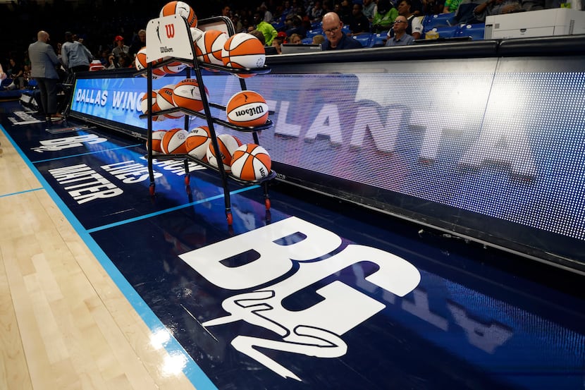 The Dallas Wings and all WNBA teams have placed a BG24 logo on their courts in honor of...