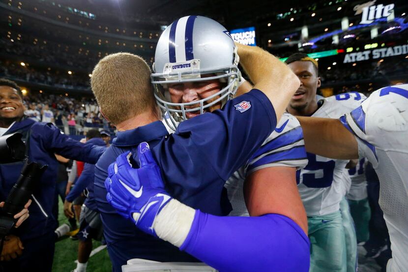 Dallas Cowboys tight end Jason Witten (82) is congratulated by head coach Jason Garrett...