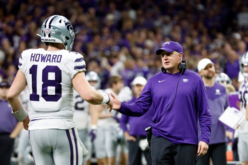 Kansas State quarterback Will Howard (18) celebrated with head coach Chris Klieman after...