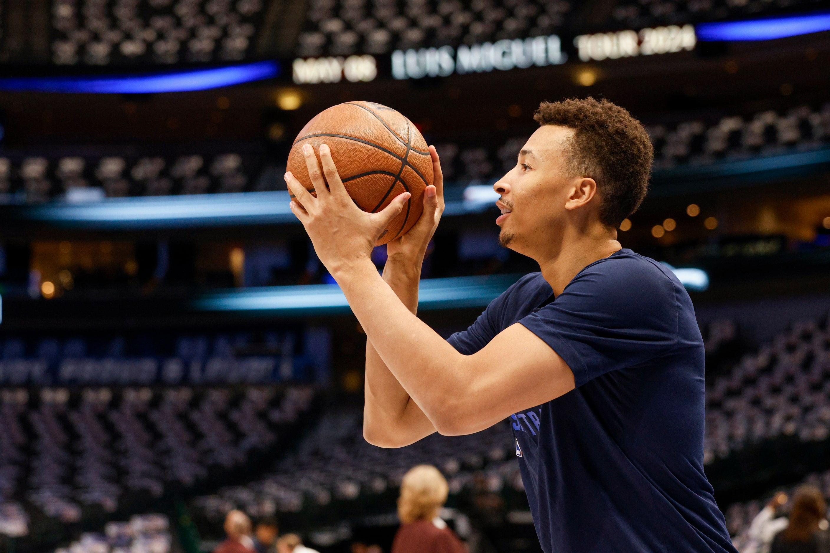 Dallas Mavericks guard Dante Exum shoots the ball before an NBA game against the Boston...