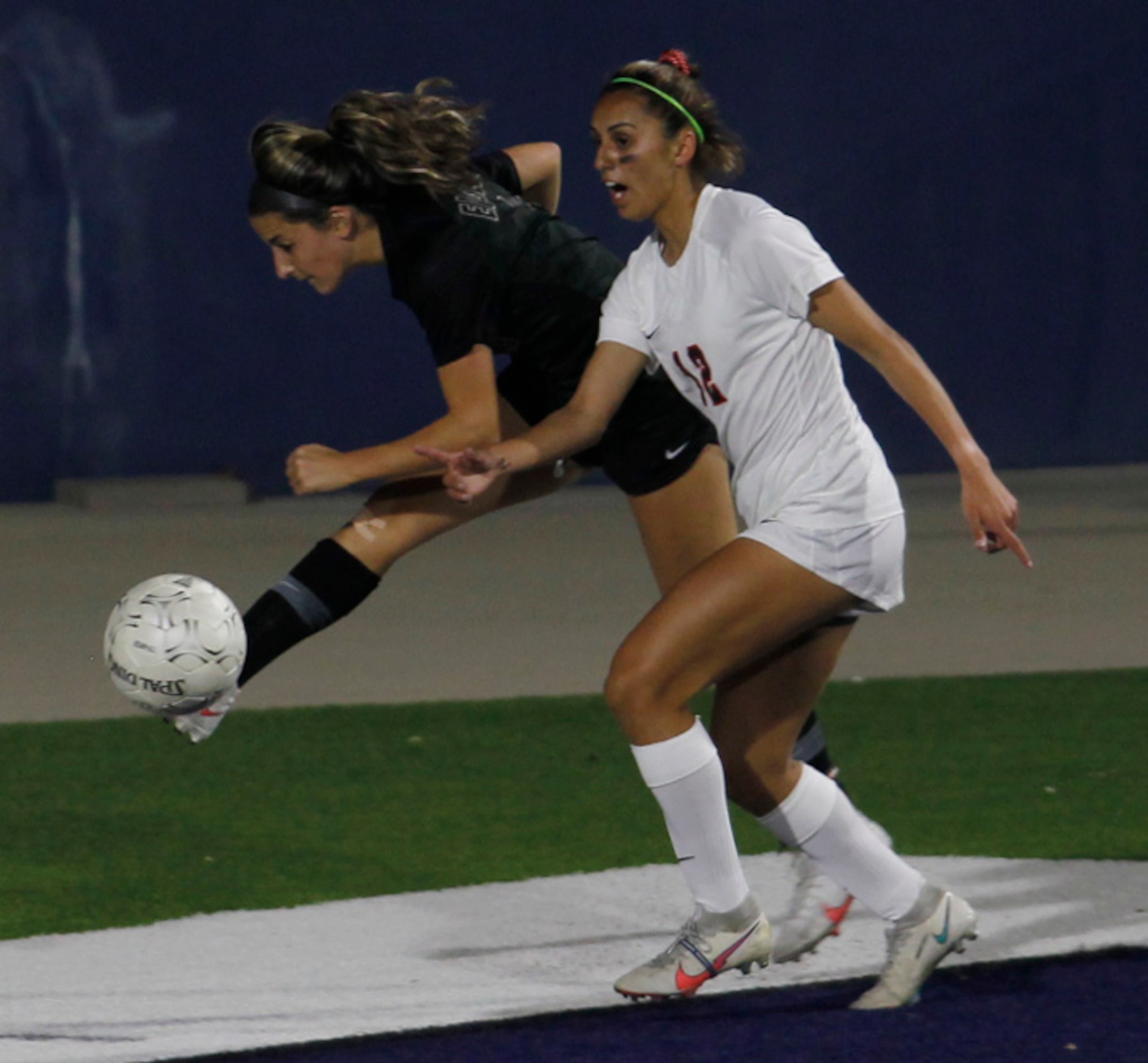 Prosper's Emma Yolinsky (11) passes from the corner as Coppell's Jocelyn Alonzo (12) defends...