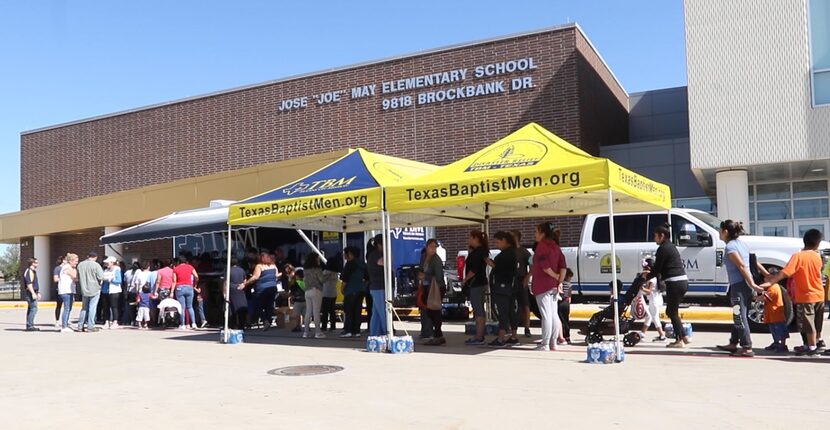 About 250 people showed up Tuesday afternoon at Joe May Elementary for a hot meal. Power...