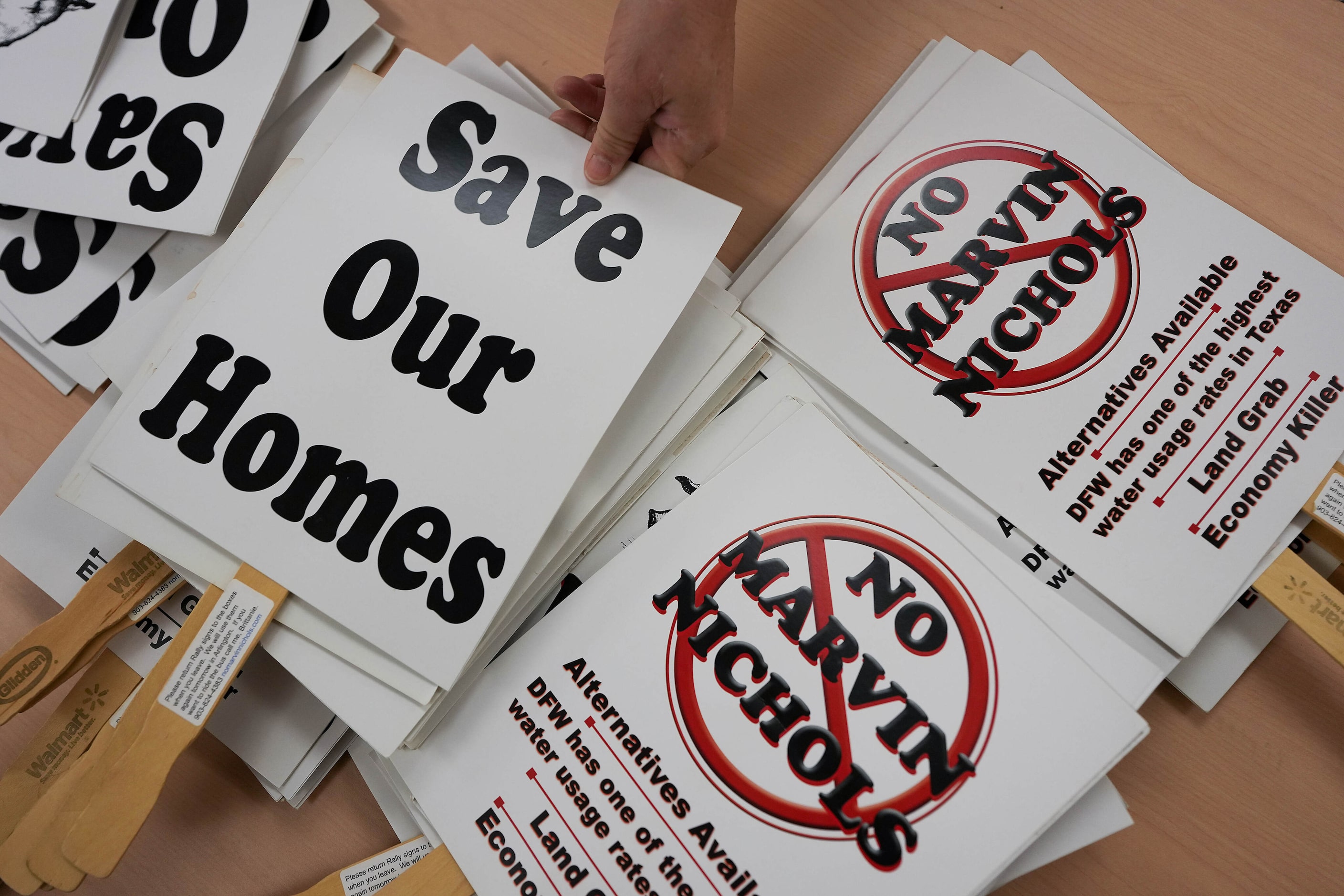 Opponents organizes signs against the proposed Marvin Nichols Reservoir during a meeting of...