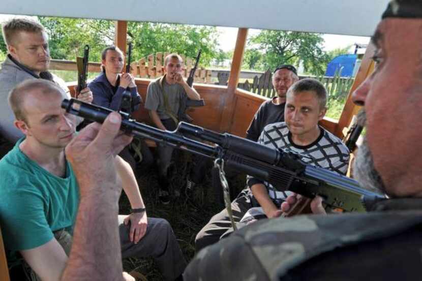 
A pro-Russia militant taught recruits how to use a machine gun near Slovyansk, Ukraine, on...