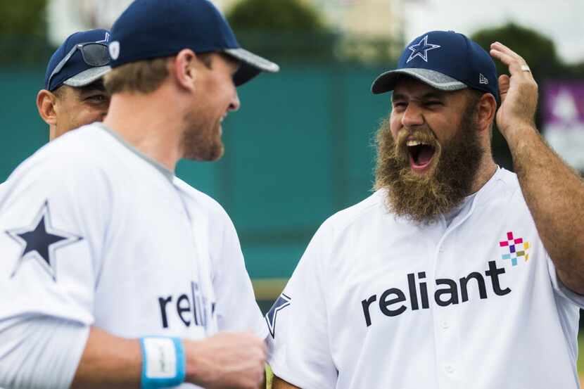 Dallas Cowboys tight end Jason Witten (82) jokes with center Travis Frederick (72) after...