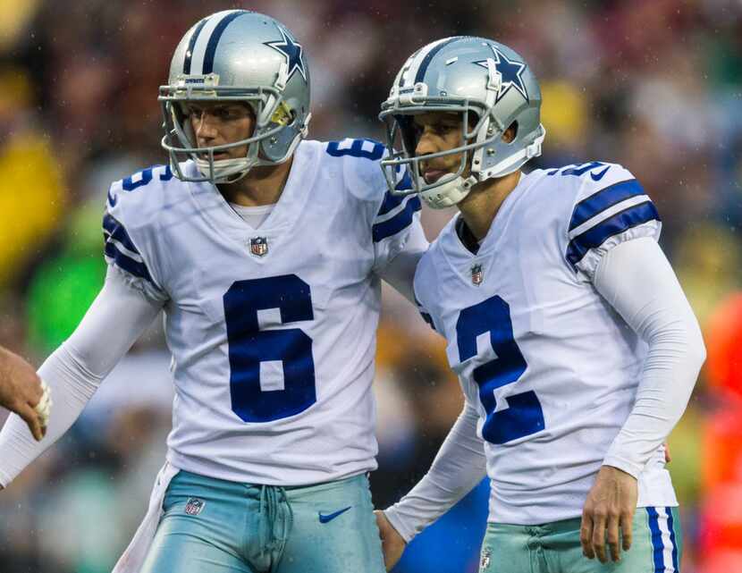Dallas Cowboys punter Chris Jones (6) and kicker Mike Nugent (2) react after a missed field...