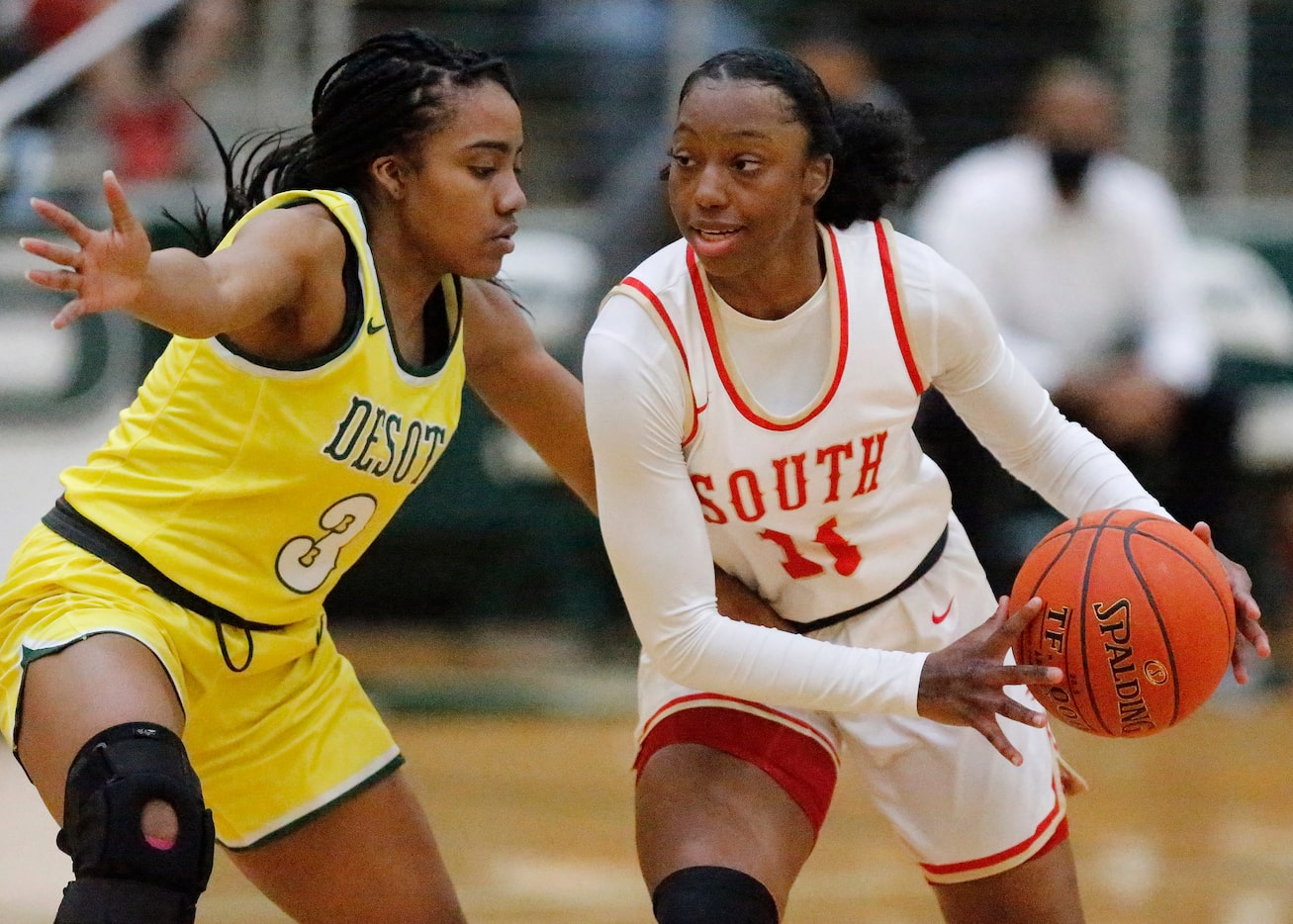 DeSoto High School guard Kayla Glover (3) defends South Grand Prairie High School guard...