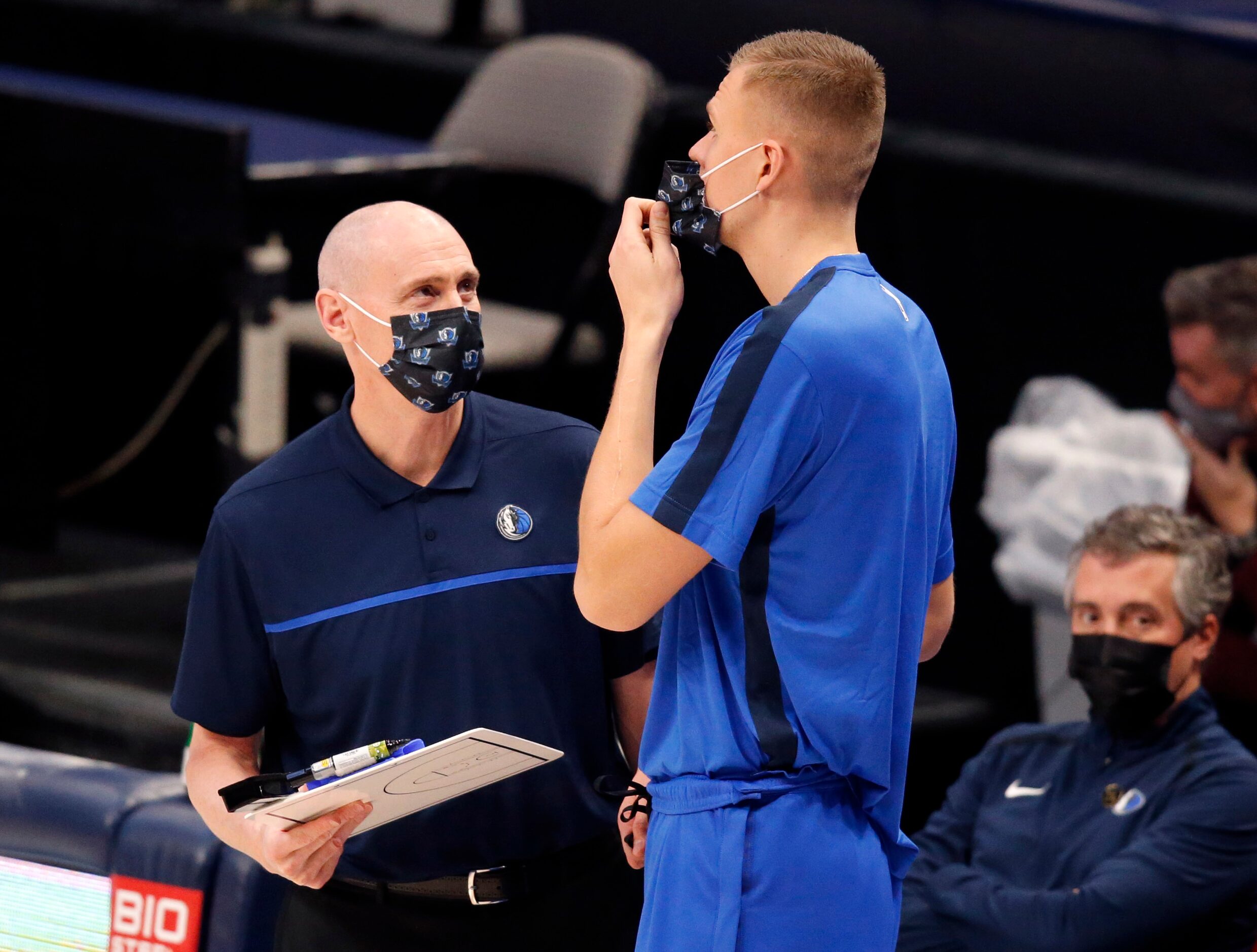 Dallas Mavericks head coach Rick Carlisle (left) and his injured player Kristaps Porzingis...