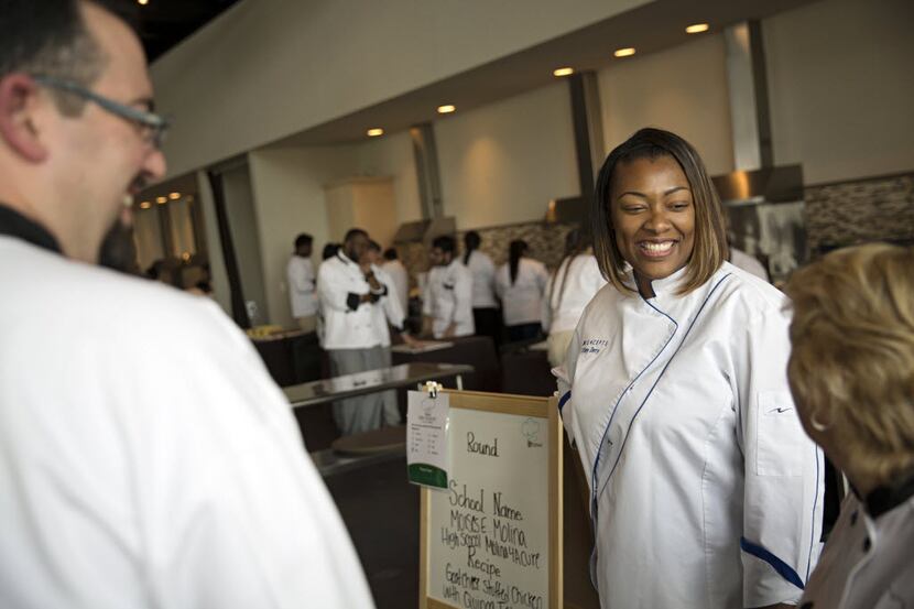 Here's how we often see Tiffany Derry: in her chef's coat, chatting with customers or...