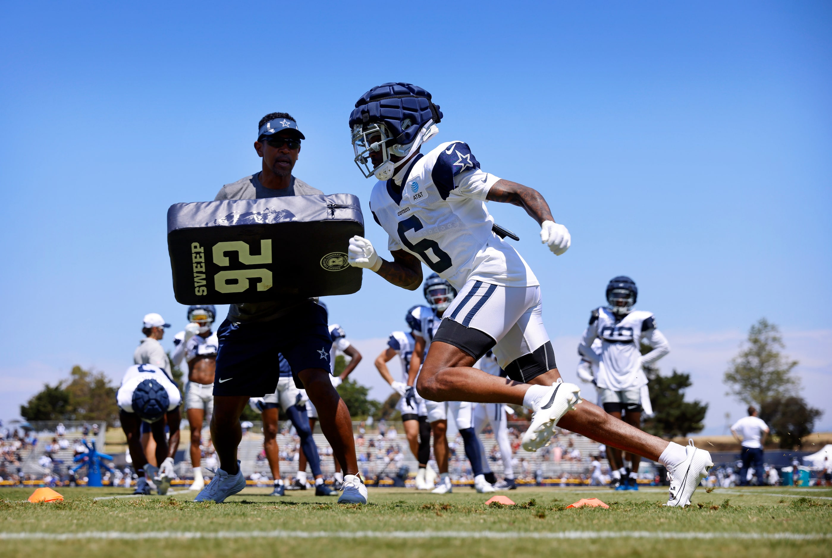 Dallas Cowboys safety Donovan Wilson (6) runs pass route drills with blocking provided by...