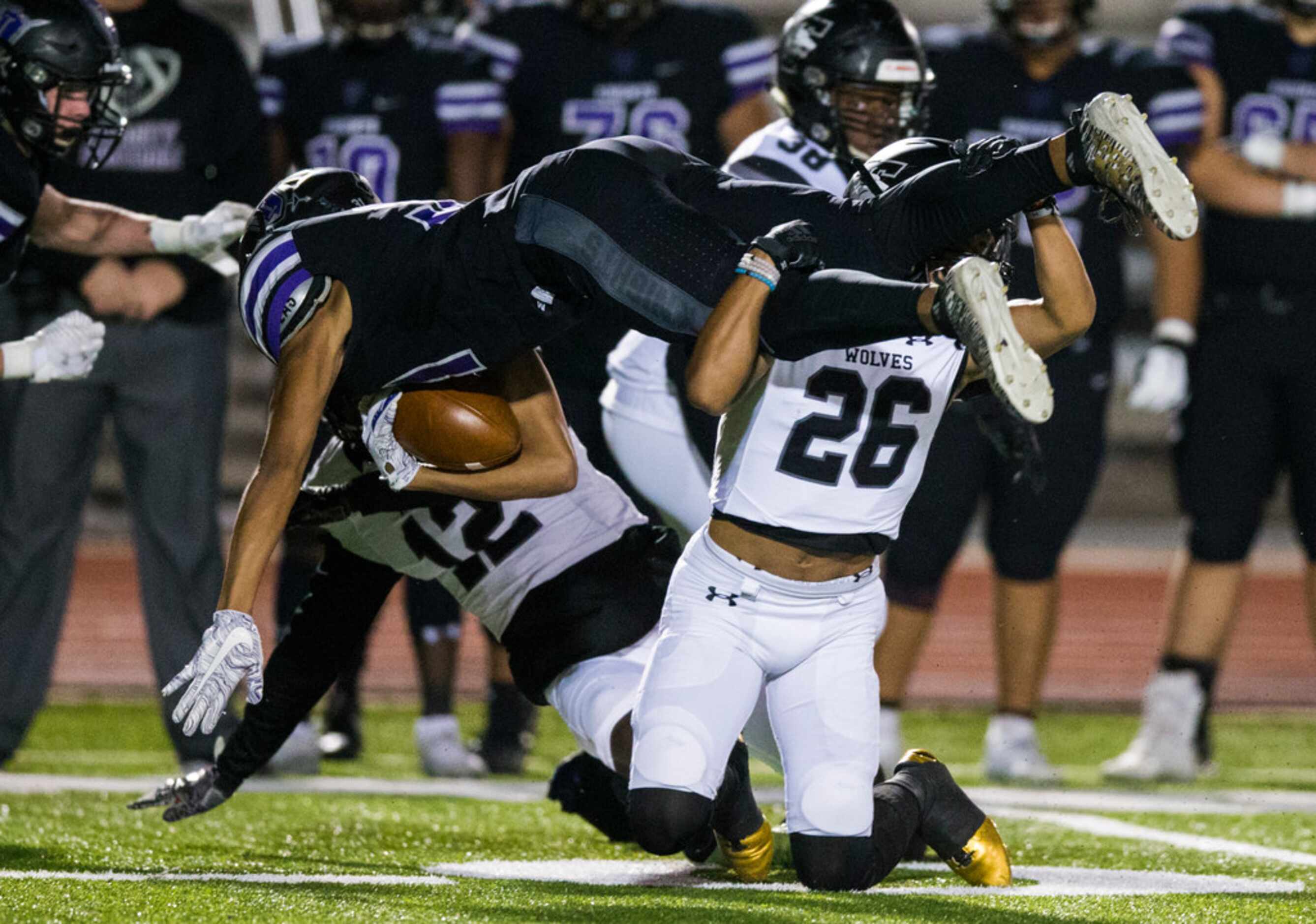 Frisco Independence running back Reggie Bush (31) is tackled by Mansfield Timberview wide...