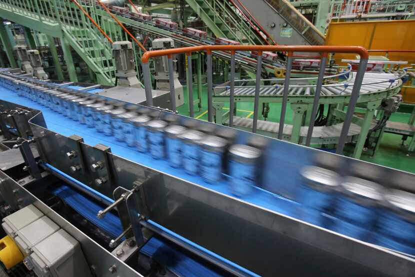 This Monday, May 29, 2017 photo shows the beer production line at an Asahi Breweries factory...