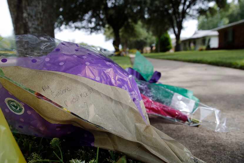 Bouquets of flowers and notes were left near the scene of a shooting on West Spring Creek...