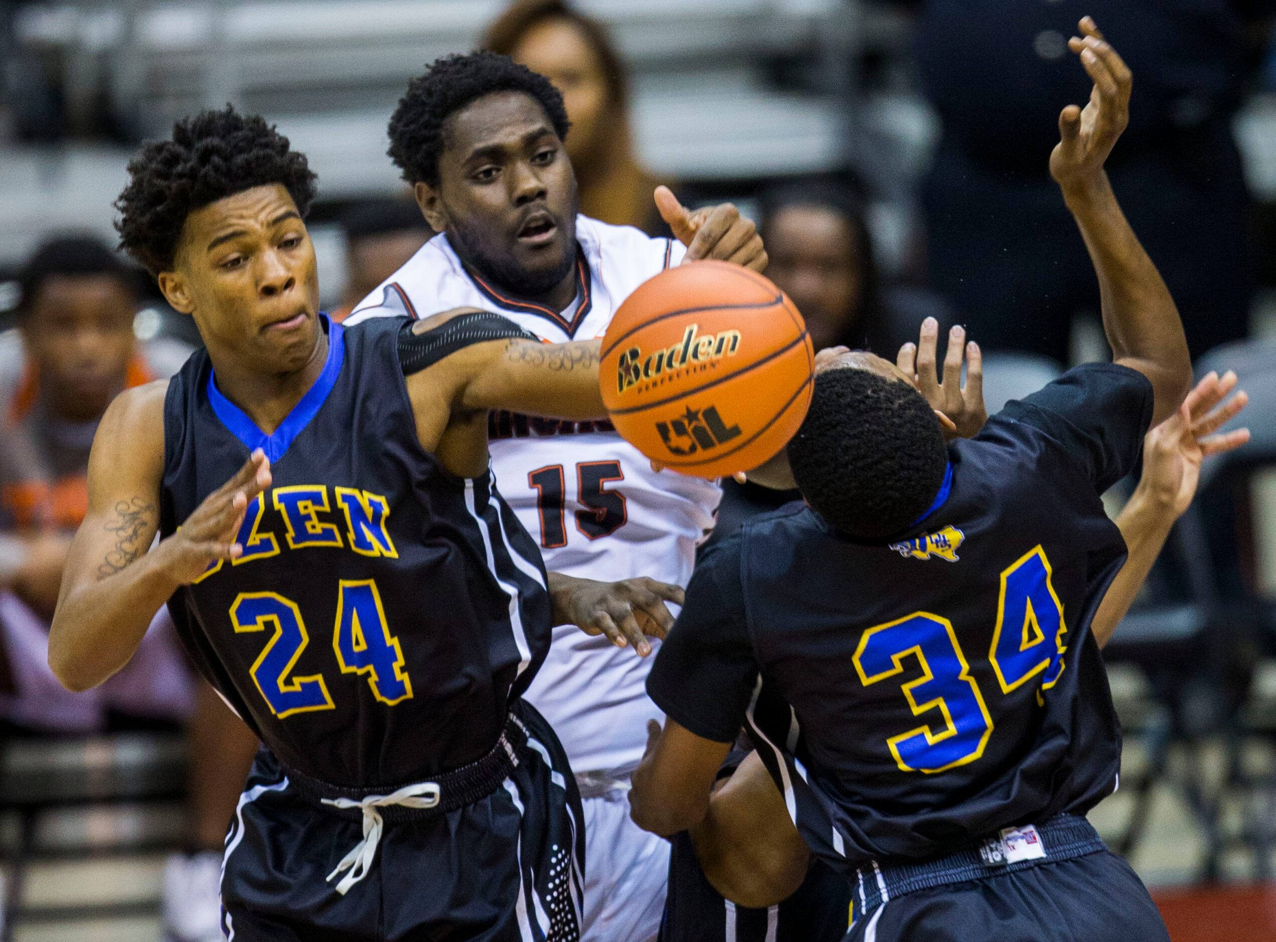 Lancaster forward/center Elijah Thomas (15) and Beaumont Ozen forward Christian Bolton (24)...