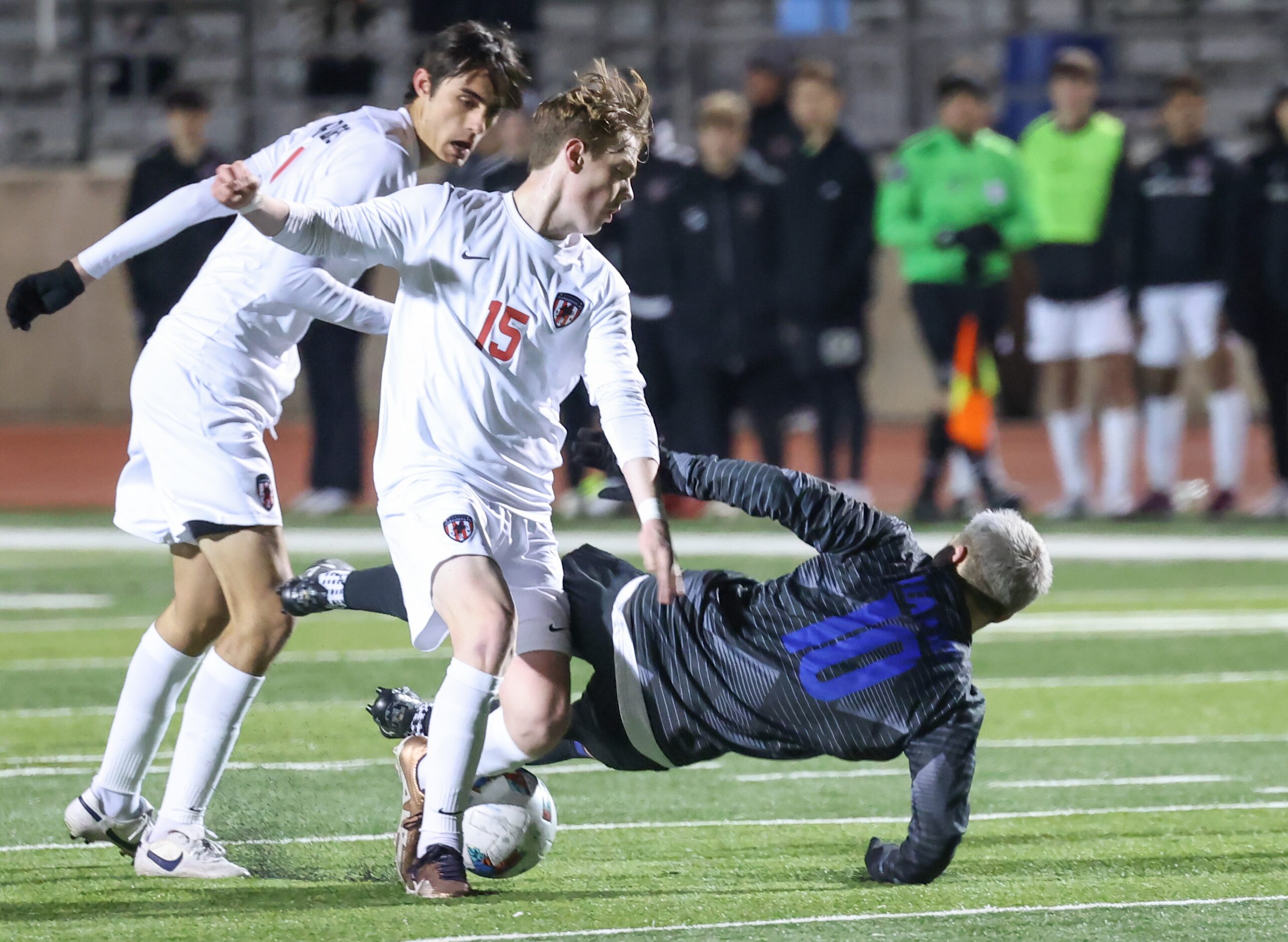 Flower Mound Marcus’ Chase Ficke (15) turns as Hebron’s Luke Dean (10) falls as they fight...