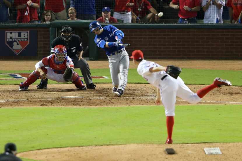 Toronto Blue Jays shortstop Troy Tulowitzki (2) hits a three run home run off Texas Rangers...