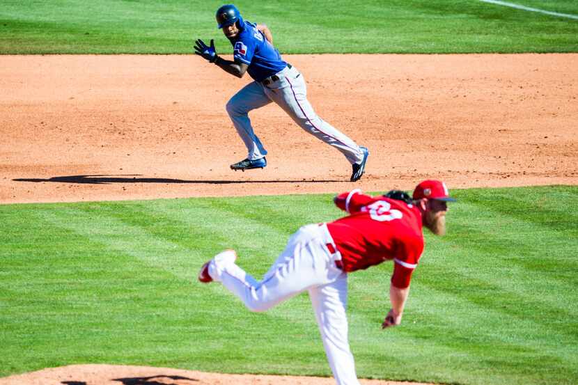Texas Rangers center fielder Delino DeShields (3) attempts to steal second base behind Los...