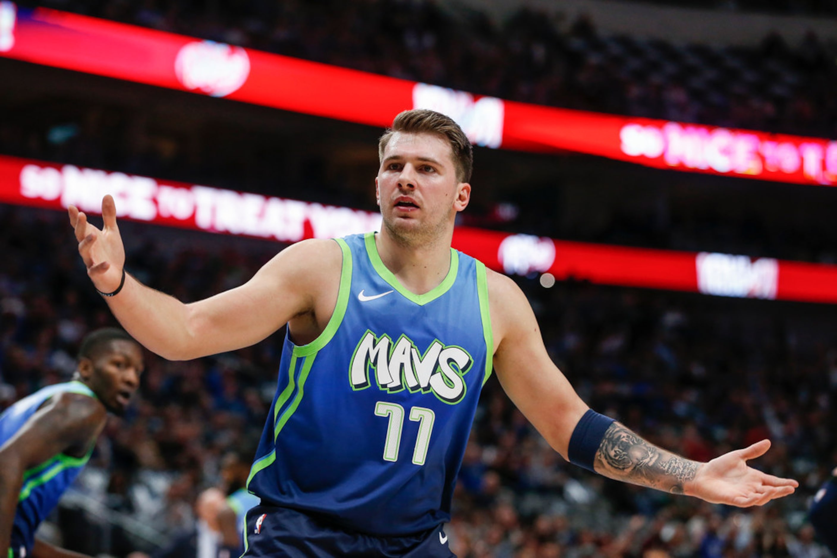 Dallas Mavericks forward Luka Doncic (77) reacts to an official's call during the first half...