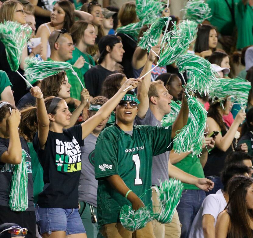 Mean Green fans try to rally their troops during a lackluster first half during the...