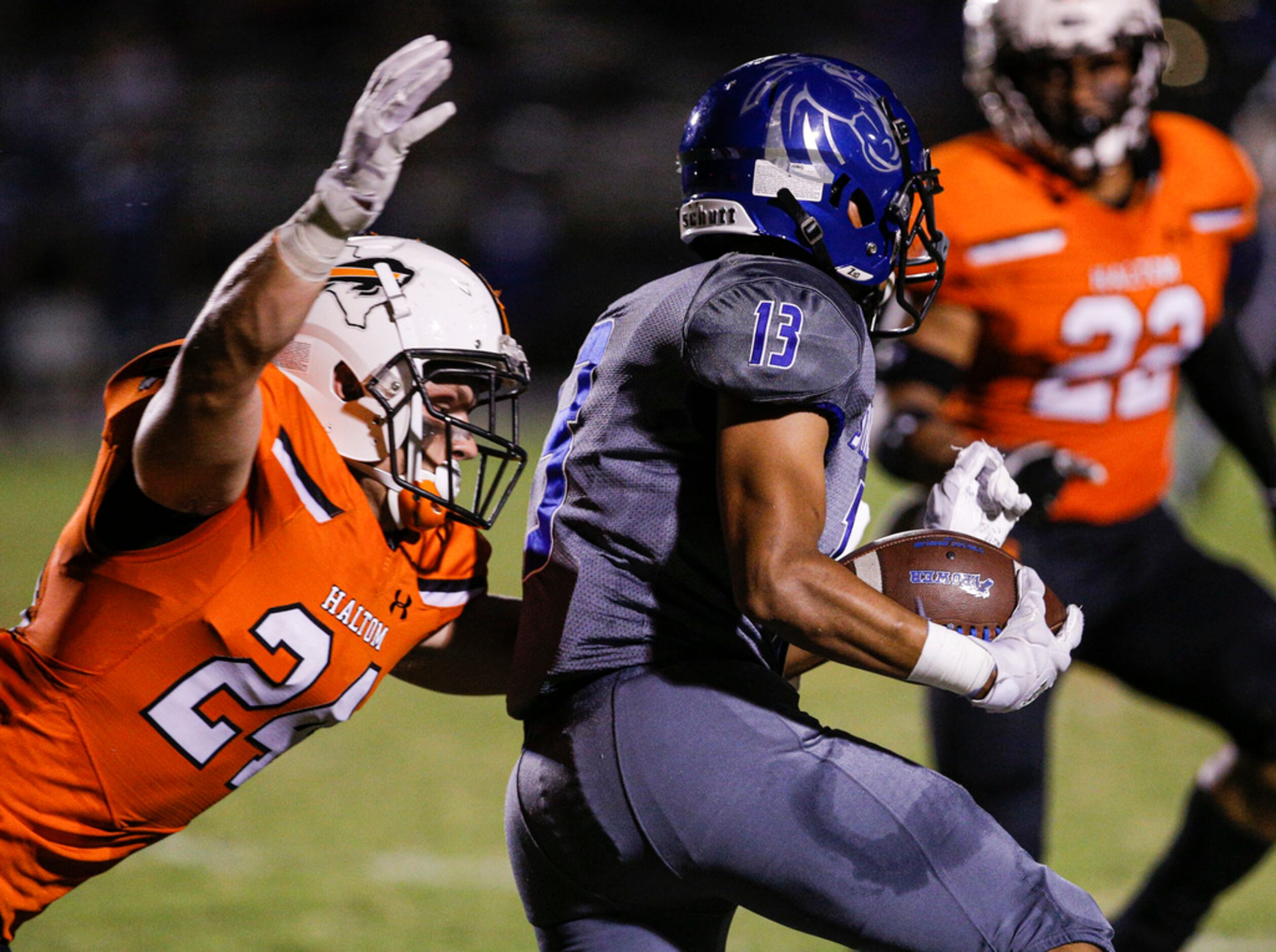 TXHSFB Haltom City senior linebacker Gavon Lange (24) tackles North Mesquite junior wide...