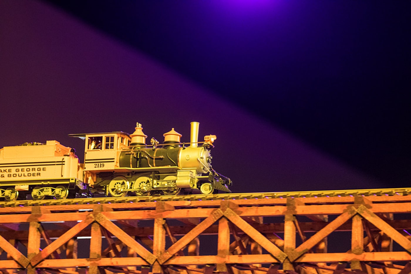 A train travels across the room during a sneak peak event for TrainTopia, the Museum of the...