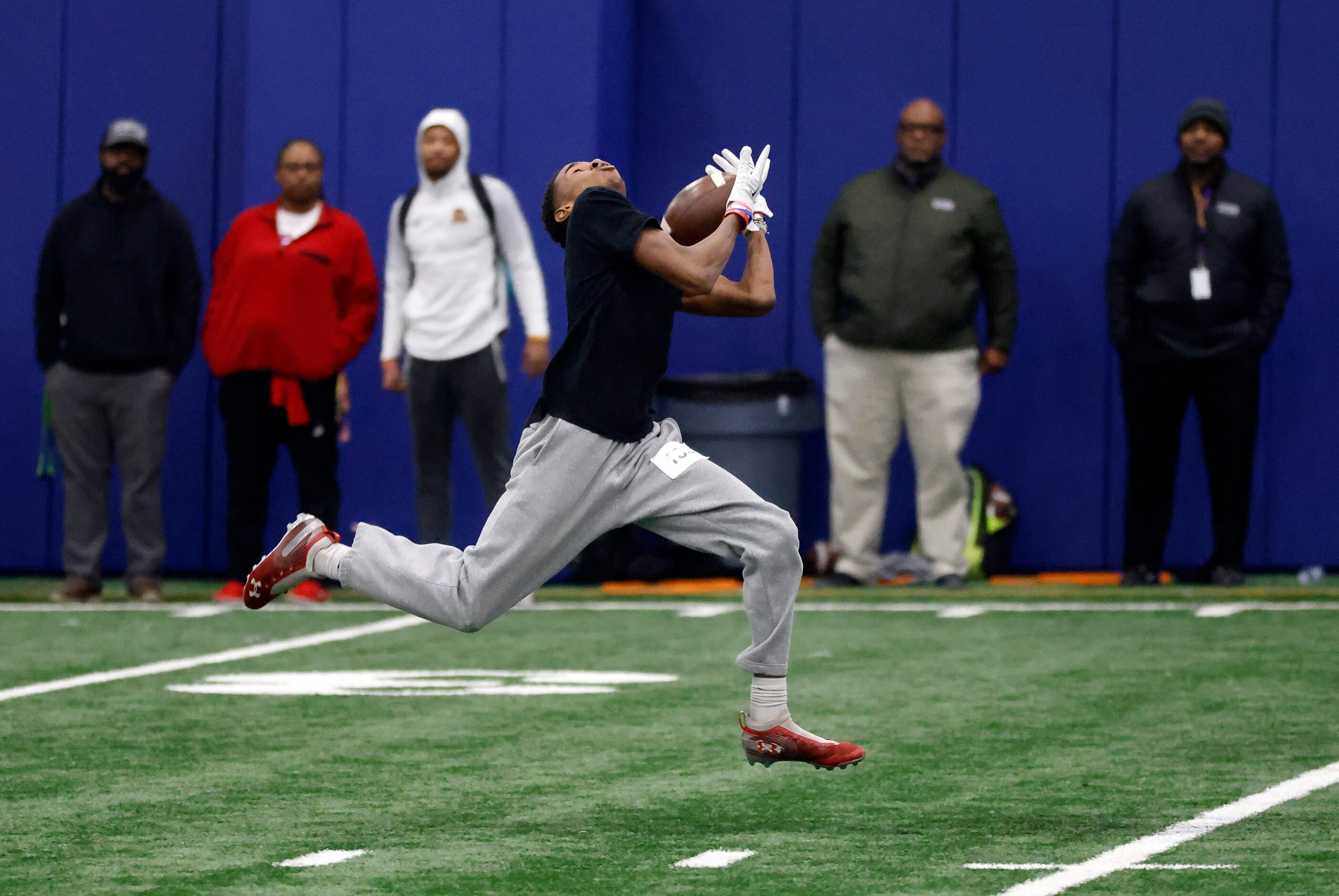 Unsigned senior wide receiver James Okolo of Rowlett High School pulls in an over the...