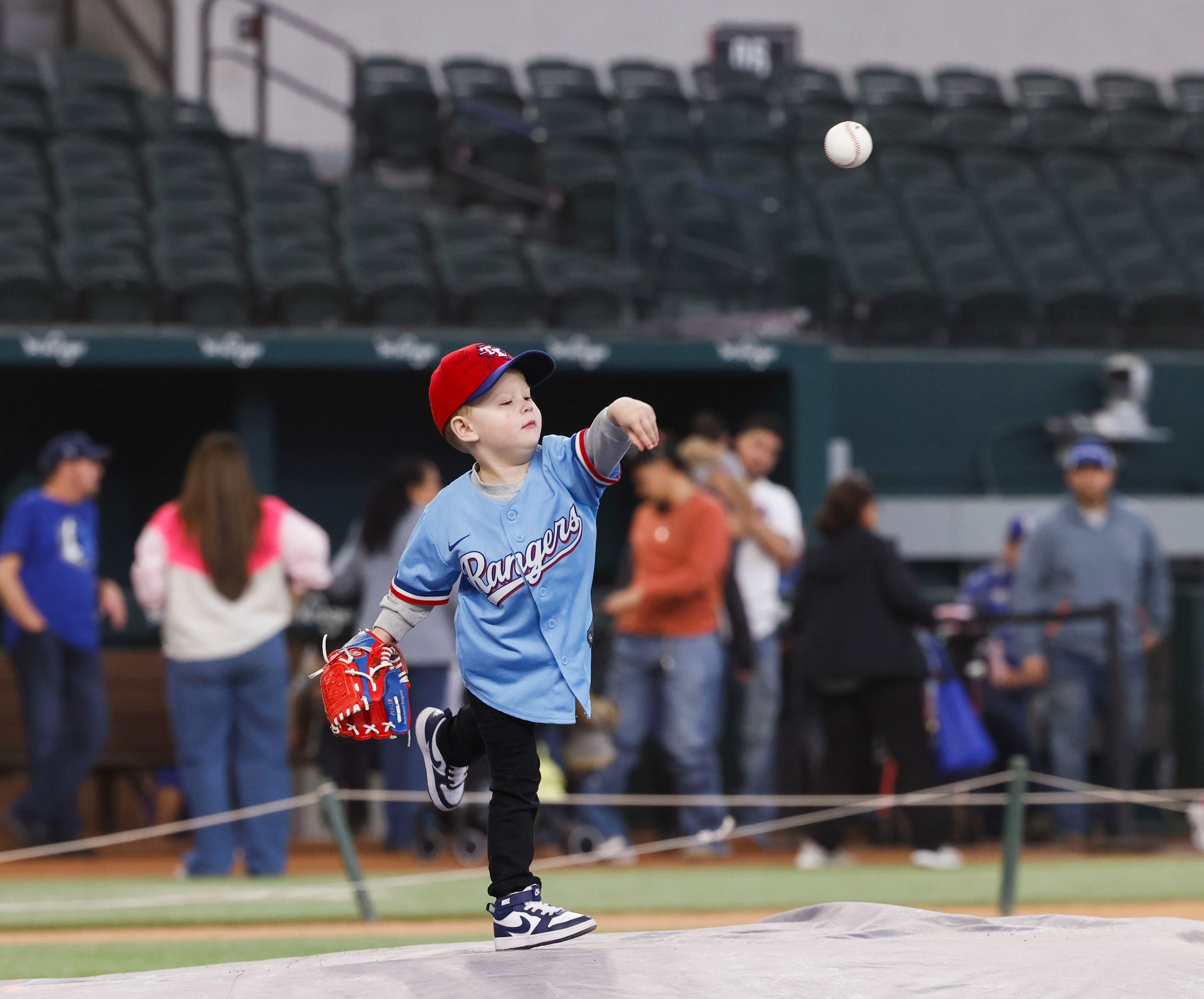 Cain Chandler, 3, throws a pitch from the pitcher’s mound during Texas Rangers Fan Fest on,...