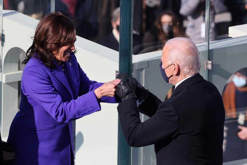 Vice President Kamala Harris and President-elect Joe Biden fist-bumped after Harris was...