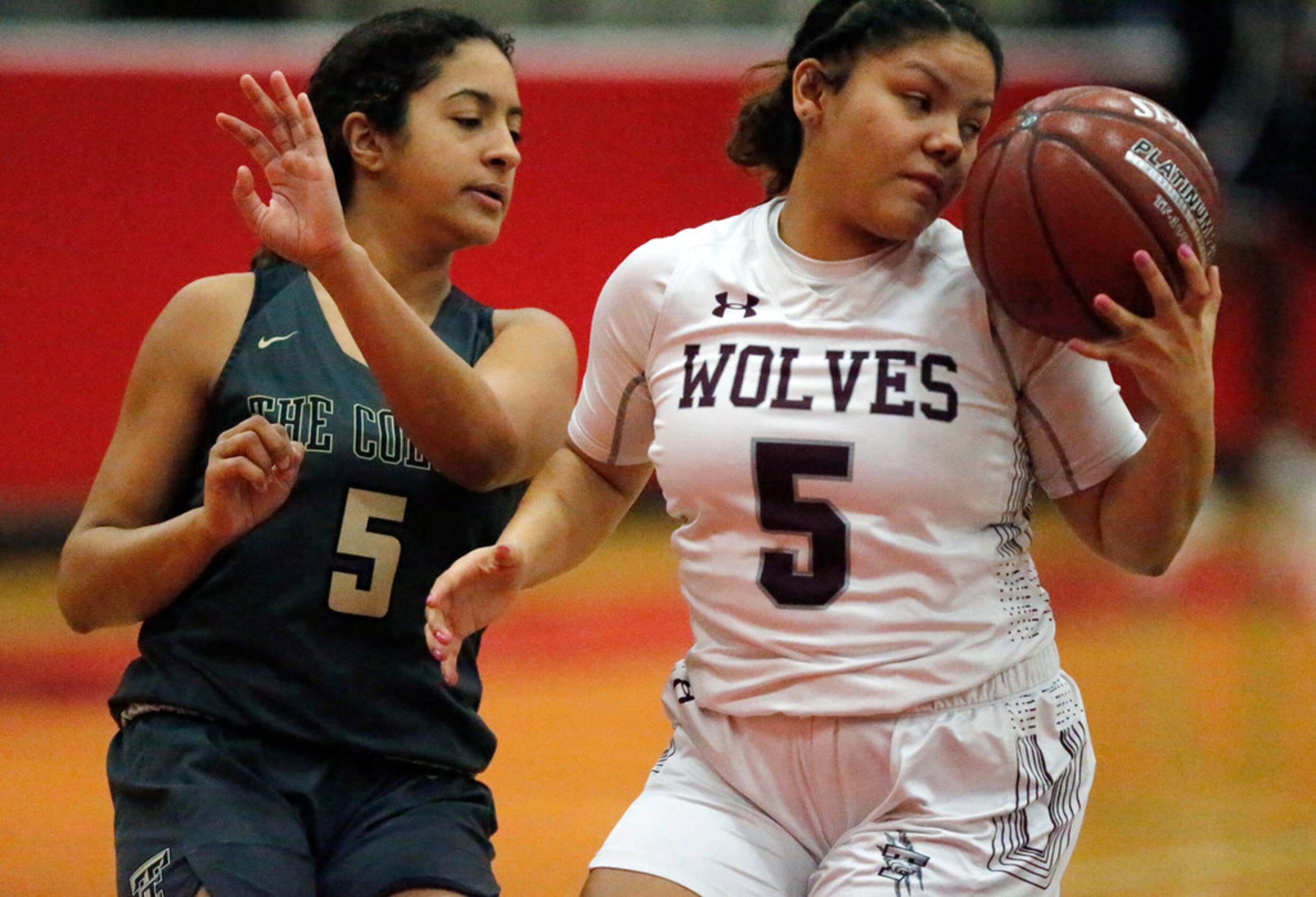 Timberview High School guard Nina Milliner (5) tries to control the basketball in front of...