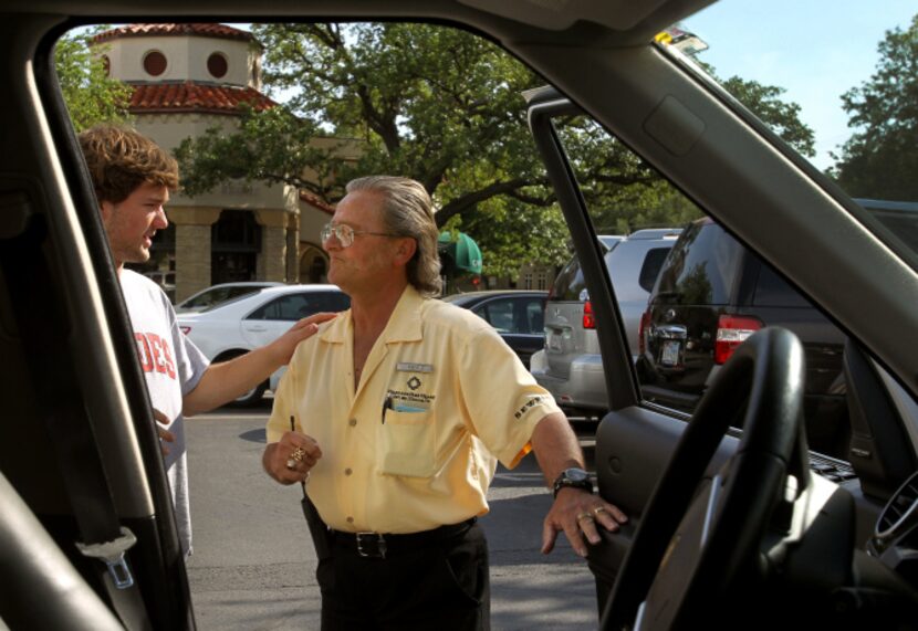 Valet Dave Ward talks with regular Corbin Wynn, left as he parks cars at the Mi Cocina at...